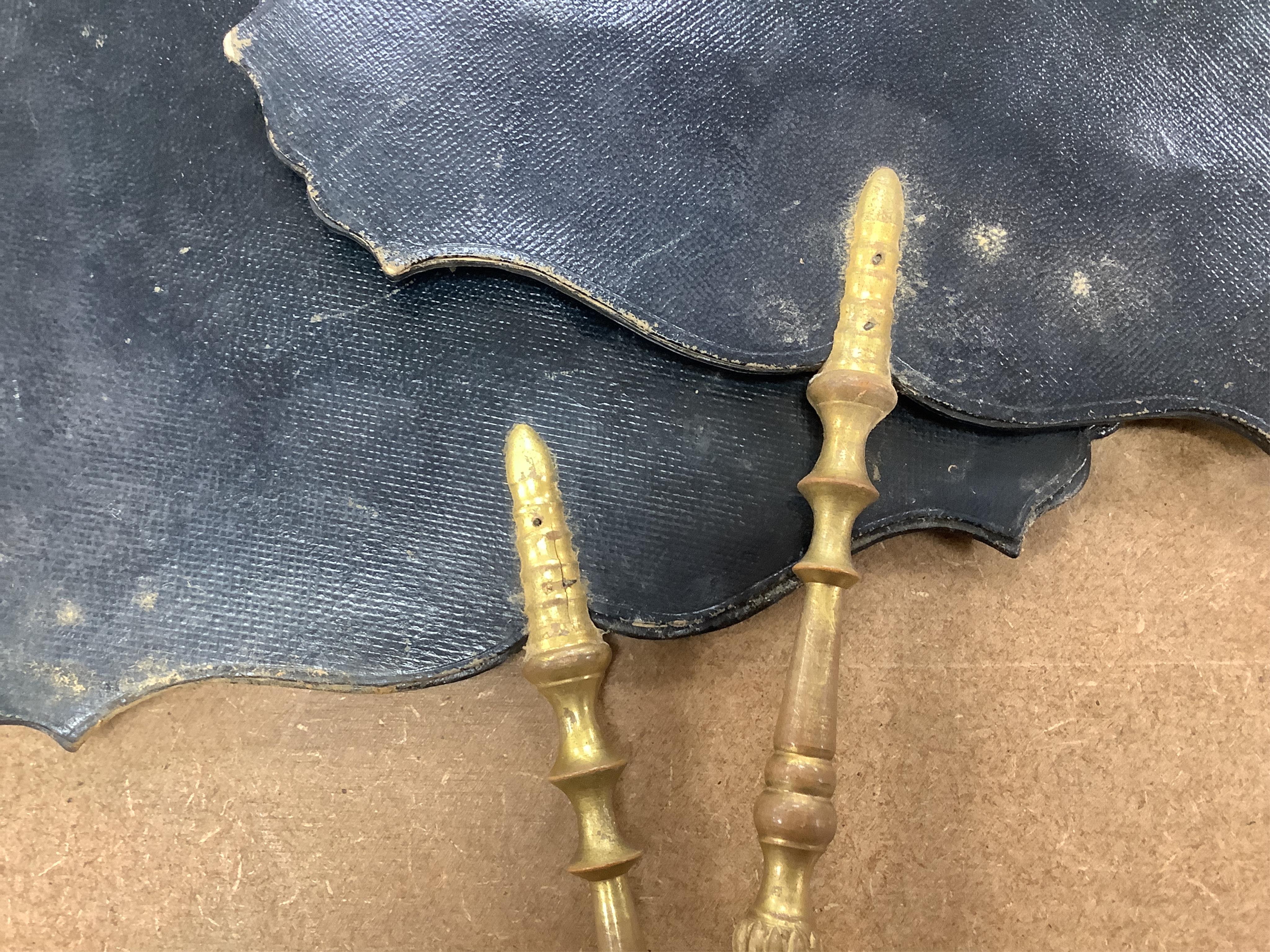 A pair of early Victorian papier maché hand screens, each with embroidered with cross stitched flowers, 41cm in length